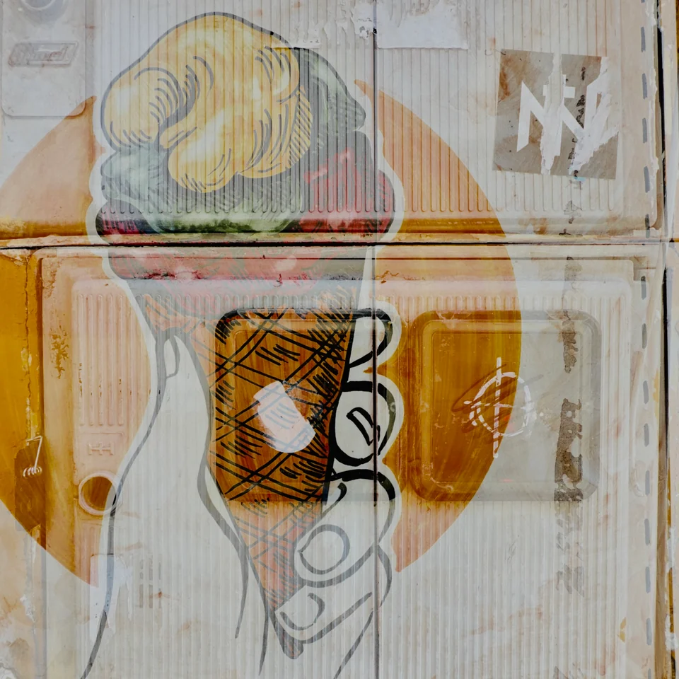 A tiled fish and coffee cup layered with street textures.